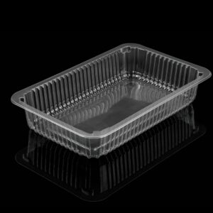 Empty clear plastic food container with reflections against a black background.